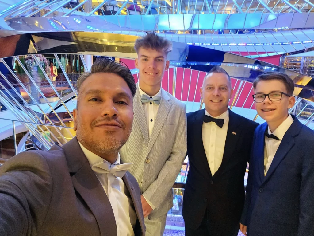 A Voyage Through Time and Tide: Exploring the English Channel Aboard Holland America Line’s Nieuw Statendam 12 Cruising with Danny and Peter, Holland America Line, Nieuw Statendam, English Channel, Sea Day, English Channel Nieuw Statendam Sea Day Experience | A luxurious scene aboard Holland America Line’s Nieuw Statendam cruising the English Channel, featuring the Main Dining Room with elegantly set tables, gourmet dishes like eggs Benedict, and large windows revealing gray-green waves; the intimate Pinnacle Grill with plush seating and a plated beef tenderloin with lobster dumplings; the World Stage theater’s circular stage and vibrant 270-degree LED screen displaying Casablanca’s Hassan II Mosque; and the ship’s sleek white hull sailing smoothly under an overcast sky, embodying modern cruising elegance.