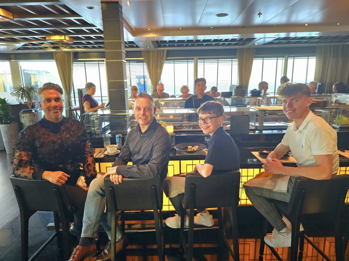 Cruising with Danny and Peter, Holland America Line, Nieuw Statendam, Atlantic Ocean Sea Day Experience | A vibrant collage capturing a sea day on Holland America’s Nieuw Statendam: a panoramic view of the Atlantic Ocean’s deep blue waves under golden sunlight from the ship’s deck; an elegant breakfast of eggs Benedict and coffee in the Main Dining Room with ocean-view windows; a digital iris collage with colorful, galaxy-like patterns created in the Explorations Central lounge; and a lively Cassidy Robertson & Company performance on the World Stage, featuring dancers in vibrant costumes against a futuristic LED backdrop.