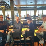 Cruising with Danny and Peter, Holland America Line, Nieuw Statendam, Atlantic Ocean Sea Day Experience | A vibrant collage capturing a sea day on Holland America’s Nieuw Statendam: a panoramic view of the Atlantic Ocean’s deep blue waves under golden sunlight from the ship’s deck; an elegant breakfast of eggs Benedict and coffee in the Main Dining Room with ocean-view windows; a digital iris collage with colorful, galaxy-like patterns created in the Explorations Central lounge; and a lively Cassidy Robertson & Company performance on the World Stage, featuring dancers in vibrant costumes against a futuristic LED backdrop.