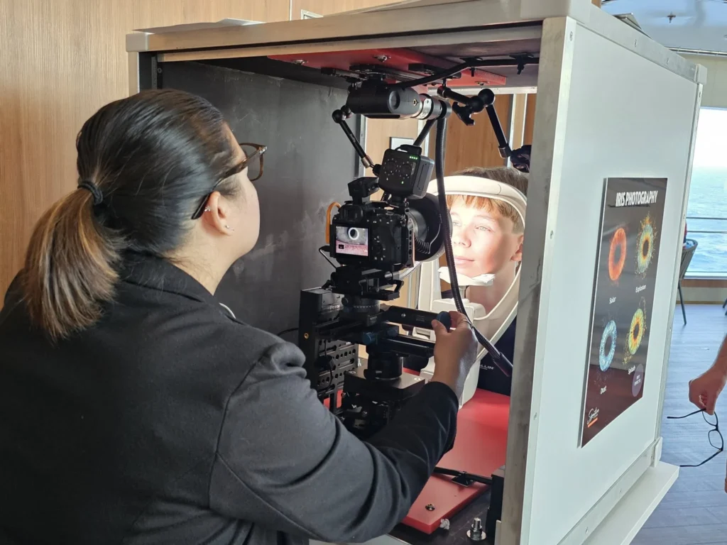 Cruising with Danny and Peter, Holland America Line, Nieuw Statendam, Atlantic Ocean Sea Day Experience | A vibrant collage capturing a sea day on Holland America’s Nieuw Statendam: a panoramic view of the Atlantic Ocean’s deep blue waves under golden sunlight from the ship’s deck; an elegant breakfast of eggs Benedict and coffee in the Main Dining Room with ocean-view windows; a digital iris collage with colorful, galaxy-like patterns created in the Explorations Central lounge; and a lively Cassidy Robertson & Company performance on the World Stage, featuring dancers in vibrant costumes against a futuristic LED backdrop.