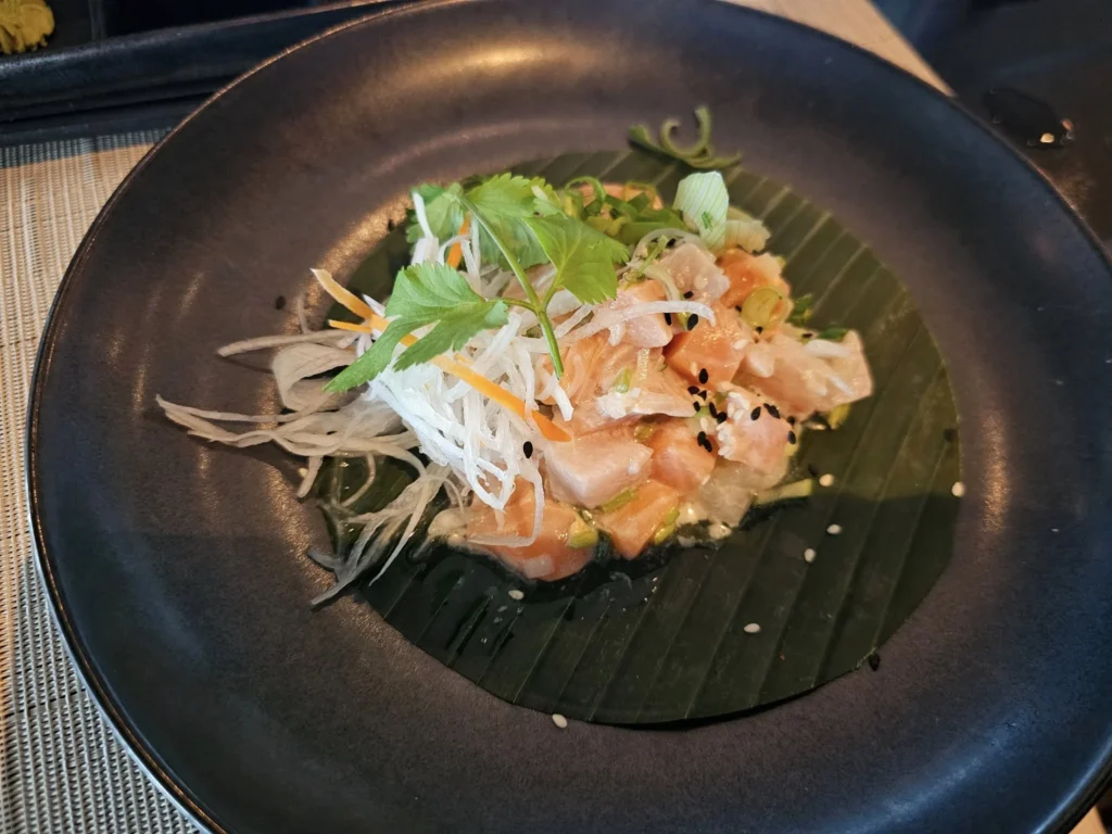 Cruising with Danny and Peter, Holland America Line, Nieuw Statendam, Atlantic Ocean Sea Day Experience | A vibrant collage capturing a sea day on Holland America’s Nieuw Statendam: a panoramic view of the Atlantic Ocean’s deep blue waves under golden sunlight from the ship’s deck; an elegant breakfast of eggs Benedict and coffee in the Main Dining Room with ocean-view windows; a digital iris collage with colorful, galaxy-like patterns created in the Explorations Central lounge; and a lively Cassidy Robertson & Company performance on the World Stage, featuring dancers in vibrant costumes against a futuristic LED backdrop.