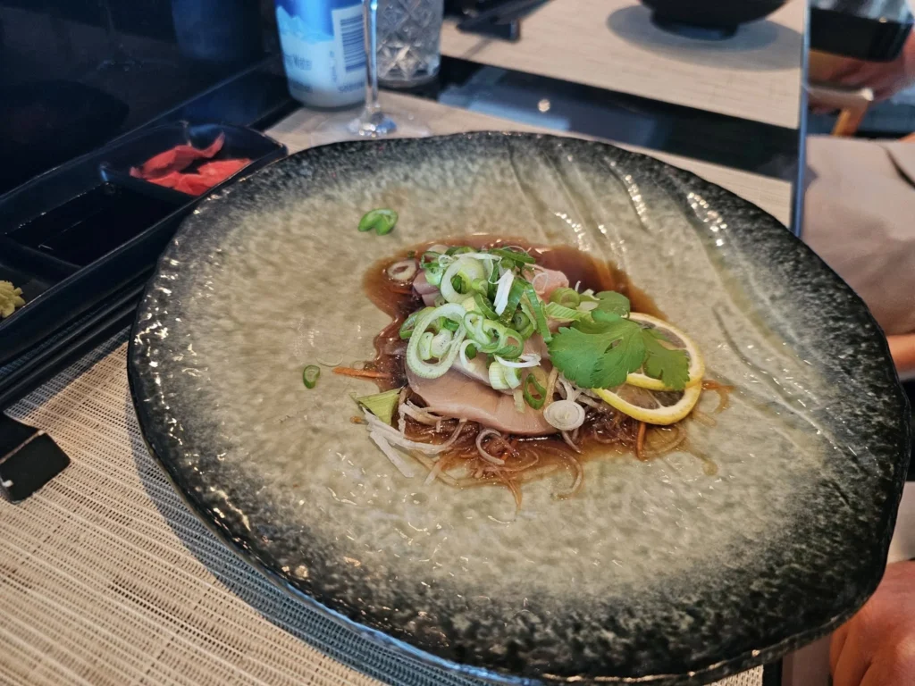 Cruising with Danny and Peter, Holland America Line, Nieuw Statendam, Atlantic Ocean Sea Day Experience | A vibrant collage capturing a sea day on Holland America’s Nieuw Statendam: a panoramic view of the Atlantic Ocean’s deep blue waves under golden sunlight from the ship’s deck; an elegant breakfast of eggs Benedict and coffee in the Main Dining Room with ocean-view windows; a digital iris collage with colorful, galaxy-like patterns created in the Explorations Central lounge; and a lively Cassidy Robertson & Company performance on the World Stage, featuring dancers in vibrant costumes against a futuristic LED backdrop.