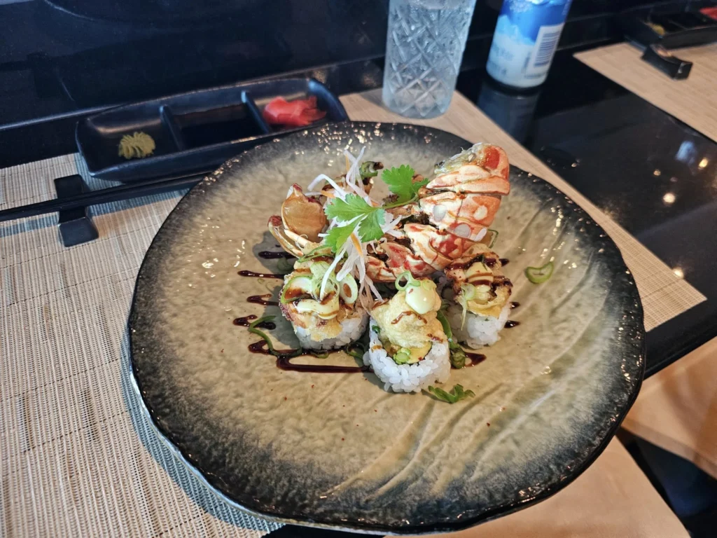 Cruising with Danny and Peter, Holland America Line, Nieuw Statendam, Atlantic Ocean Sea Day Experience | A vibrant collage capturing a sea day on Holland America’s Nieuw Statendam: a panoramic view of the Atlantic Ocean’s deep blue waves under golden sunlight from the ship’s deck; an elegant breakfast of eggs Benedict and coffee in the Main Dining Room with ocean-view windows; a digital iris collage with colorful, galaxy-like patterns created in the Explorations Central lounge; and a lively Cassidy Robertson & Company performance on the World Stage, featuring dancers in vibrant costumes against a futuristic LED backdrop.