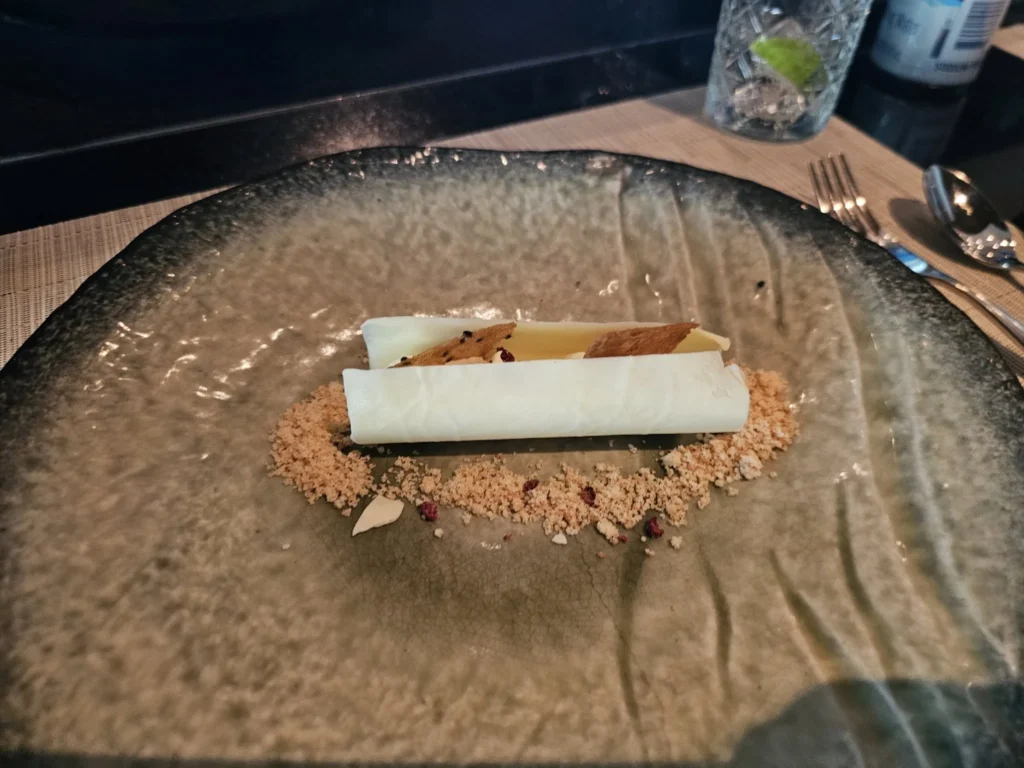 Cruising with Danny and Peter, Holland America Line, Nieuw Statendam, Atlantic Ocean Sea Day Experience | A vibrant collage capturing a sea day on Holland America’s Nieuw Statendam: a panoramic view of the Atlantic Ocean’s deep blue waves under golden sunlight from the ship’s deck; an elegant breakfast of eggs Benedict and coffee in the Main Dining Room with ocean-view windows; a digital iris collage with colorful, galaxy-like patterns created in the Explorations Central lounge; and a lively Cassidy Robertson & Company performance on the World Stage, featuring dancers in vibrant costumes against a futuristic LED backdrop.