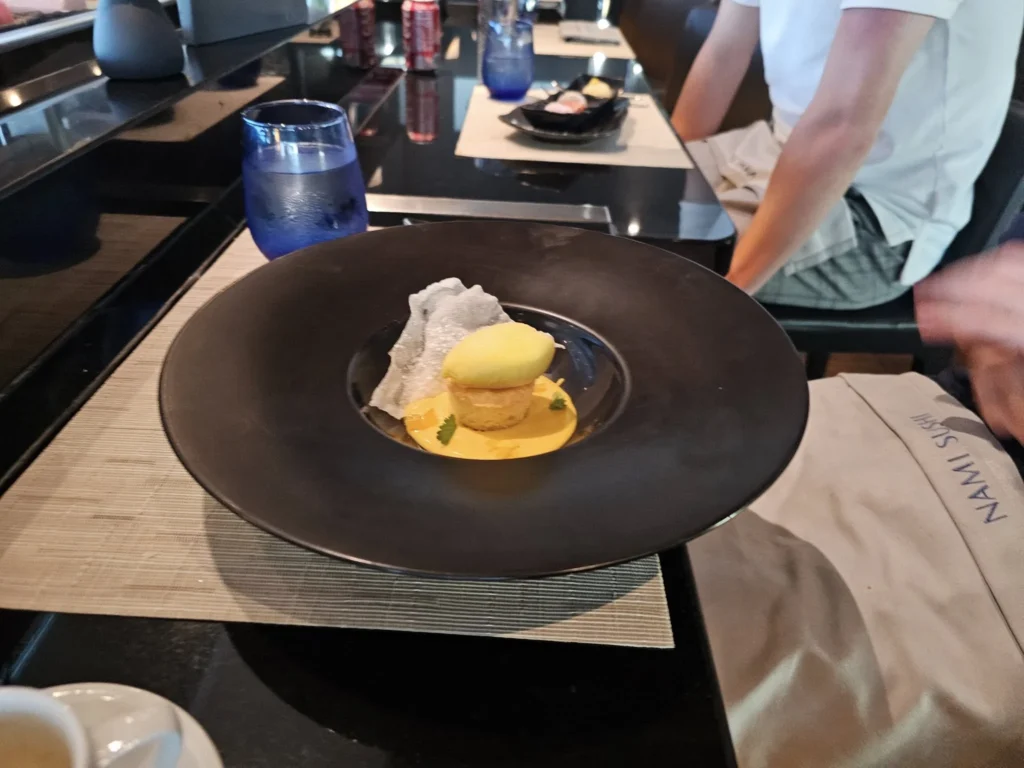 Cruising with Danny and Peter, Holland America Line, Nieuw Statendam, Atlantic Ocean Sea Day Experience | A vibrant collage capturing a sea day on Holland America’s Nieuw Statendam: a panoramic view of the Atlantic Ocean’s deep blue waves under golden sunlight from the ship’s deck; an elegant breakfast of eggs Benedict and coffee in the Main Dining Room with ocean-view windows; a digital iris collage with colorful, galaxy-like patterns created in the Explorations Central lounge; and a lively Cassidy Robertson & Company performance on the World Stage, featuring dancers in vibrant costumes against a futuristic LED backdrop.