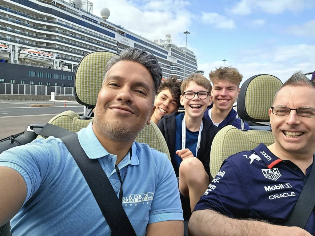 Cruising with Danny and Peter, Holland America Line, Nieuw Statendam, Arrecife, Lanzarote, Canary Islands, Volcanic Adventure | A vibrant collage capturing an adventure in Arrecife, Lanzarote: the dark, winding lava tunnels of Cueva de los Verdes illuminated by soft lights; the serene turquoise pool and lush greenery of Jameos del Agua with its volcanic cave backdrop; the sweeping ocean views from Mirador del Río’s cliffside lookout, framing La Graciosa island; and the surreal, Mars-like red and black lava fields of Timanfaya National Park under a clear sky, showcasing Lanzarote’s volcanic beauty.