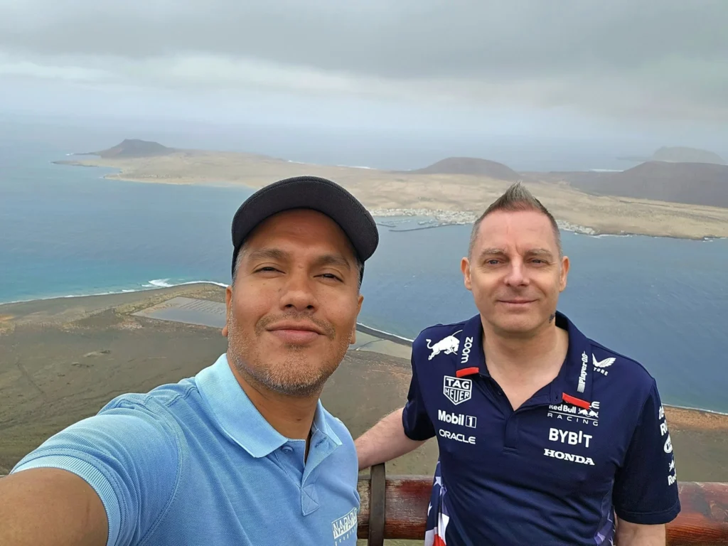 Cruising with Danny and Peter, Holland America Line, Nieuw Statendam, Arrecife, Lanzarote, Canary Islands, Volcanic Adventure | A vibrant collage capturing an adventure in Arrecife, Lanzarote: the dark, winding lava tunnels of Cueva de los Verdes illuminated by soft lights; the serene turquoise pool and lush greenery of Jameos del Agua with its volcanic cave backdrop; the sweeping ocean views from Mirador del Río’s cliffside lookout, framing La Graciosa island; and the surreal, Mars-like red and black lava fields of Timanfaya National Park under a clear sky, showcasing Lanzarote’s volcanic beauty.