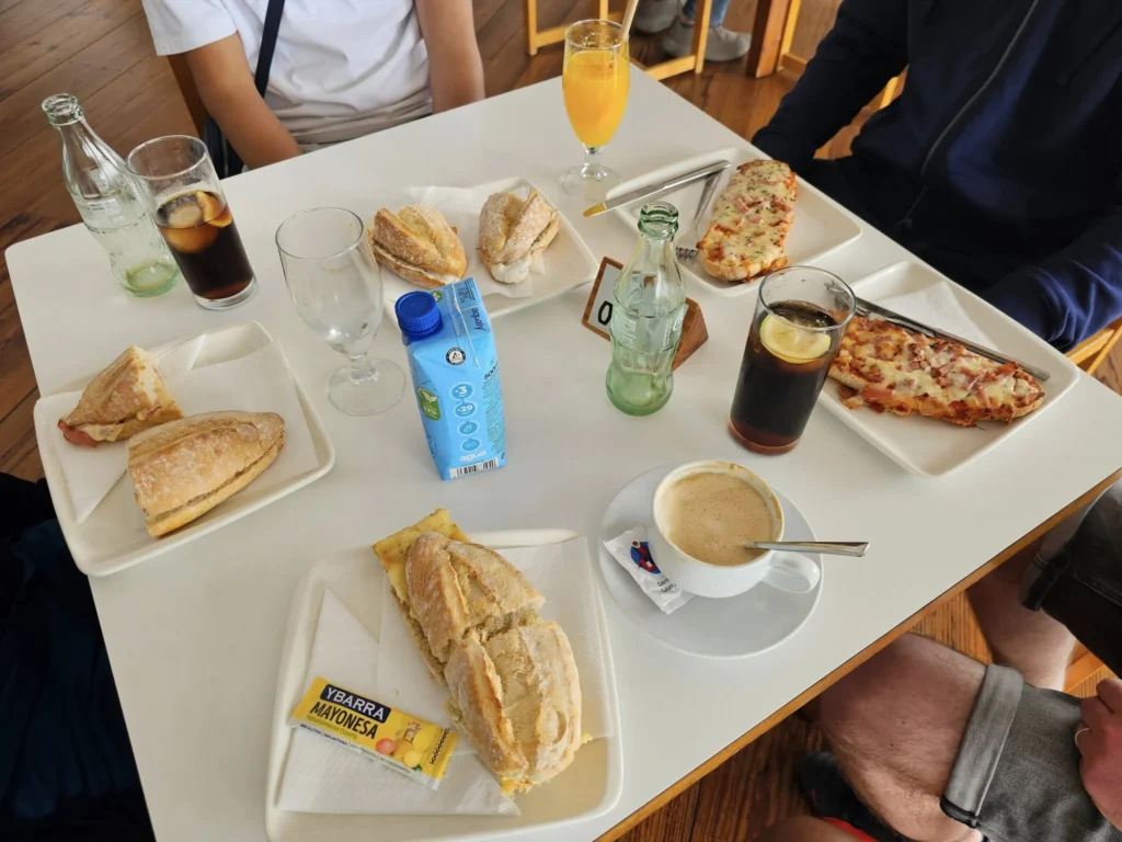 Cruising with Danny and Peter, Holland America Line, Nieuw Statendam, Arrecife, Lanzarote, Canary Islands, Volcanic Adventure | A vibrant collage capturing an adventure in Arrecife, Lanzarote: the dark, winding lava tunnels of Cueva de los Verdes illuminated by soft lights; the serene turquoise pool and lush greenery of Jameos del Agua with its volcanic cave backdrop; the sweeping ocean views from Mirador del Río’s cliffside lookout, framing La Graciosa island; and the surreal, Mars-like red and black lava fields of Timanfaya National Park under a clear sky, showcasing Lanzarote’s volcanic beauty.