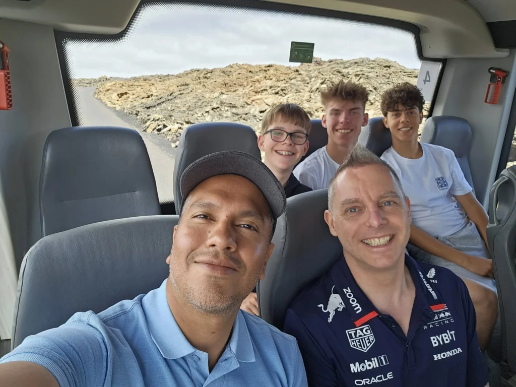 Cruising with Danny and Peter, Holland America Line, Nieuw Statendam, Arrecife, Lanzarote, Canary Islands, Volcanic Adventure | A vibrant collage capturing an adventure in Arrecife, Lanzarote: the dark, winding lava tunnels of Cueva de los Verdes illuminated by soft lights; the serene turquoise pool and lush greenery of Jameos del Agua with its volcanic cave backdrop; the sweeping ocean views from Mirador del Río’s cliffside lookout, framing La Graciosa island; and the surreal, Mars-like red and black lava fields of Timanfaya National Park under a clear sky, showcasing Lanzarote’s volcanic beauty.