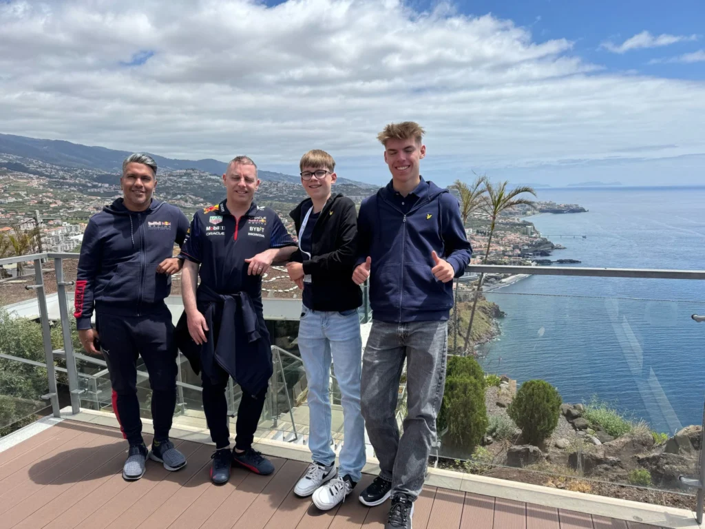 Cruising with Danny and Peter, Holland America Line, Nieuw Statendam, Funchal, Madeira. Portugal, History Adventure | A vibrant collage capturing a day in Funchal, Madeira: a sleek trike navigates winding roads with lush green hills in the background; the panoramic view from Pico dos Barcelos showcases Funchal Bay and the Desertas Islands under a clear sky; Cascata dos Anjos waterfall cascades from cliffs onto a road, surrounded by verdant greenery; Praia da Madalena do Mar’s pebbled beach and black volcanic sand meet gentle waves with towering cliffs above; the misty Valley of the Nuns nestles between rugged mountains, dotted with stone houses and chestnut groves; Cabo Girão’s glass-bottomed skywalk reveals a dizzying drop to the Atlantic and terraced fields below; a plate of warm bolo do caco flatbread filled with steak sits on a café table in Funchal’s colorful old town; the CR7 Museum displays Cristiano Ronaldo’s trophies and jerseys with a waterfront view of the Nieuw Statendam; and Nami Sushi Bar’s elegant sushi platter gleams under soft lighting aboard the ship.