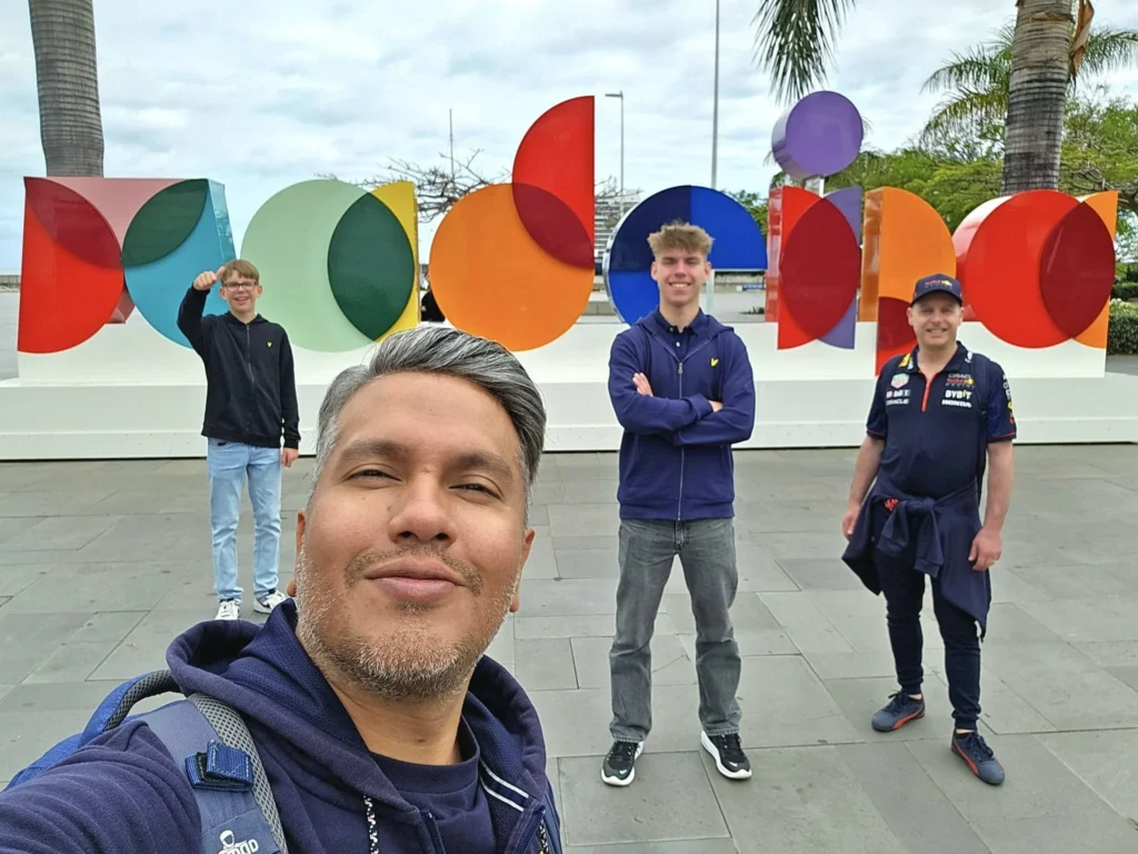 Cruising with Danny and Peter, Holland America Line, Nieuw Statendam, Funchal, Madeira. Portugal, History Adventure | A vibrant collage capturing a day in Funchal, Madeira: a sleek trike navigates winding roads with lush green hills in the background; the panoramic view from Pico dos Barcelos showcases Funchal Bay and the Desertas Islands under a clear sky; Cascata dos Anjos waterfall cascades from cliffs onto a road, surrounded by verdant greenery; Praia da Madalena do Mar’s pebbled beach and black volcanic sand meet gentle waves with towering cliffs above; the misty Valley of the Nuns nestles between rugged mountains, dotted with stone houses and chestnut groves; Cabo Girão’s glass-bottomed skywalk reveals a dizzying drop to the Atlantic and terraced fields below; a plate of warm bolo do caco flatbread filled with steak sits on a café table in Funchal’s colorful old town; the CR7 Museum displays Cristiano Ronaldo’s trophies and jerseys with a waterfront view of the Nieuw Statendam; and Nami Sushi Bar’s elegant sushi platter gleams under soft lighting aboard the ship.