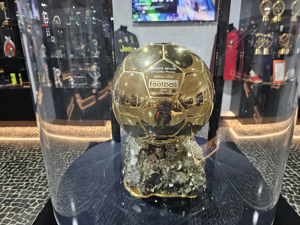 Cruising with Danny and Peter, Holland America Line, Nieuw Statendam, Funchal, Madeira. Portugal, History Adventure | A vibrant collage capturing a day in Funchal, Madeira: a sleek trike navigates winding roads with lush green hills in the background; the panoramic view from Pico dos Barcelos showcases Funchal Bay and the Desertas Islands under a clear sky; Cascata dos Anjos waterfall cascades from cliffs onto a road, surrounded by verdant greenery; Praia da Madalena do Mar’s pebbled beach and black volcanic sand meet gentle waves with towering cliffs above; the misty Valley of the Nuns nestles between rugged mountains, dotted with stone houses and chestnut groves; Cabo Girão’s glass-bottomed skywalk reveals a dizzying drop to the Atlantic and terraced fields below; a plate of warm bolo do caco flatbread filled with steak sits on a café table in Funchal’s colorful old town; the CR7 Museum displays Cristiano Ronaldo’s trophies and jerseys with a waterfront view of the Nieuw Statendam; and Nami Sushi Bar’s elegant sushi platter gleams under soft lighting aboard the ship.