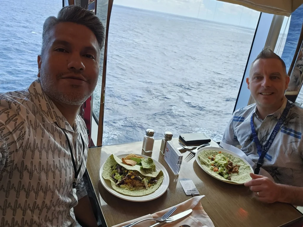 Cruising with Danny and Peter, Holland America Line, Nieuw Statendam, Atlantic Ocean, Sea Day, Adventure | A family savors a Nieuw Statendam Sea Day, enjoying a breakfast of cheesy omelets in the elegant main dining room, indulging in sushi rolls at the vibrant Lido Market, and feasting on a seafood boil with crab legs under starlit skies. The Atlantic Ocean sparkles outside, enhancing Holland America’s luxurious cruise experience with gourmet dining and relaxation.