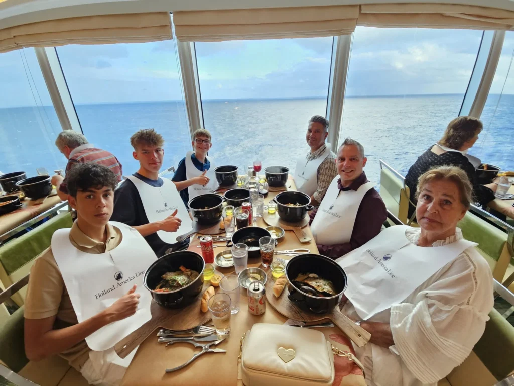 Cruising with Danny and Peter, Holland America Line, Nieuw Statendam, Atlantic Ocean, Sea Day, Adventure | A family savors a Nieuw Statendam Sea Day, enjoying a breakfast of cheesy omelets in the elegant main dining room, indulging in sushi rolls at the vibrant Lido Market, and feasting on a seafood boil with crab legs under starlit skies. The Atlantic Ocean sparkles outside, enhancing Holland America’s luxurious cruise experience with gourmet dining and relaxation.