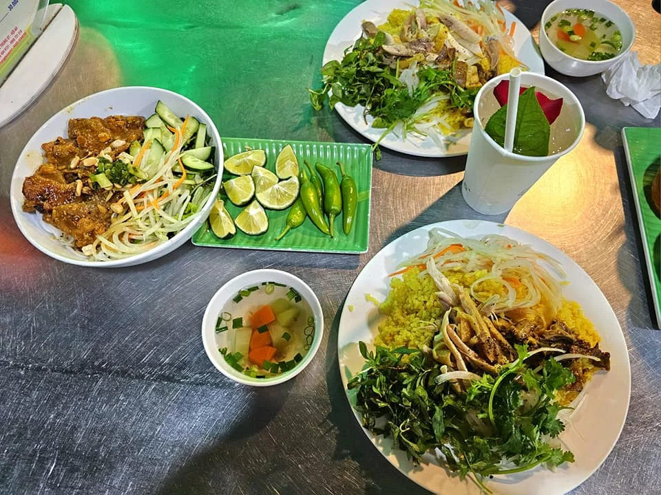 Cruising with Danny and Peter, Holland America Line, Westerdam, Da Nang, Hue, Hoi An, Vietnam, Hoi An Travel Guide: 10 Unmissable Adventures | Collage of a Hội An Travel Guide adventure: Tourists enjoying a Basket Boat Ride through Cam Thanh Eco-Village’s lush waterways, local farmers tending organic herbs at Tra Que Village showcasing Vietnamese Culture, the historic Japanese Bridge in Hội An Old Town, a close-up of creamy Egg Coffee from Vietnamese Cuisine, vibrant Lantern-Lit Streets glowing at night, and a scenic view from a Da Nang Day Trip to kick off this unforgettable journey.