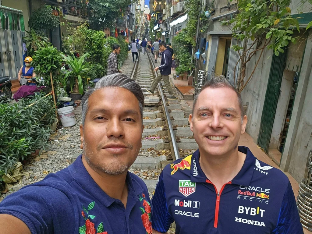 Cruising with Danny and Peter, Holland America Line, Westerdam, Halong Bay, Hanoi, Vietnam, Vietnam Travel Eexperience Hanoi Halong Bay | Kayaking through emerald waters during a Hạ Long Bay Adventure with limestone karsts, a train passing inches from cafés on Hanoi Railway Street showcasing Hanoi Street Life, the granite Ho Chi Minh Mausoleum in Ba Dinh Square honoring the Ho Chi Minh Legacy, the lotus-shaped One Pillar Pagoda in a pond among Hanoi Historical Sites, ancient courtyards of the Temple of Literature from a Vietnam Heritage Journey, vibrant street food stalls in an Old Quarter Food Tour, and creamy egg coffee at Cafe Giảng for an Egg Coffee Experience, all part of an unforgettable Vietnam Travel Experience and Hanoi Cultural Exploration Tour.