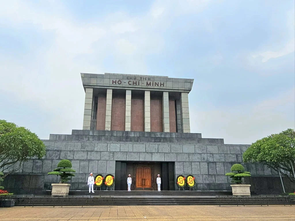 Cruising with Danny and Peter, Holland America Line, Westerdam, Halong Bay, Hanoi, Vietnam, Vietnam Travel Eexperience Hanoi Halong Bay | Kayaking through emerald waters during a Hạ Long Bay Adventure with limestone karsts, a train passing inches from cafés on Hanoi Railway Street showcasing Hanoi Street Life, the granite Ho Chi Minh Mausoleum in Ba Dinh Square honoring the Ho Chi Minh Legacy, the lotus-shaped One Pillar Pagoda in a pond among Hanoi Historical Sites, ancient courtyards of the Temple of Literature from a Vietnam Heritage Journey, vibrant street food stalls in an Old Quarter Food Tour, and creamy egg coffee at Cafe Giảng for an Egg Coffee Experience, all part of an unforgettable Vietnam Travel Experience and Hanoi Cultural Exploration Tour.