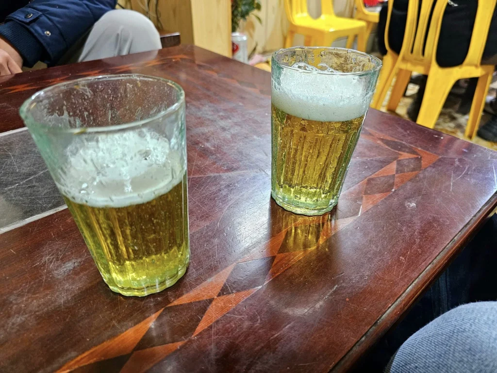 Cruising with Danny and Peter, Holland America Line, Westerdam, Halong Bay, Hanoi, Vietnam, Vietnam Travel Eexperience Hanoi Halong Bay | Kayaking through emerald waters during a Hạ Long Bay Adventure with limestone karsts, a train passing inches from cafés on Hanoi Railway Street showcasing Hanoi Street Life, the granite Ho Chi Minh Mausoleum in Ba Dinh Square honoring the Ho Chi Minh Legacy, the lotus-shaped One Pillar Pagoda in a pond among Hanoi Historical Sites, ancient courtyards of the Temple of Literature from a Vietnam Heritage Journey, vibrant street food stalls in an Old Quarter Food Tour, and creamy egg coffee at Cafe Giảng for an Egg Coffee Experience, all part of an unforgettable Vietnam Travel Experience and Hanoi Cultural Exploration Tour.