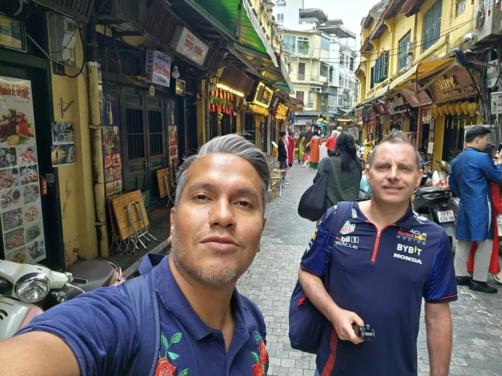 Cruising with Danny and Peter, Holland America Line, Westerdam, Halong Bay, Hanoi, Vietnam, Vietnam Travel Eexperience Hanoi Halong Bay | Kayaking through emerald waters during a Hạ Long Bay Adventure with limestone karsts, a train passing inches from cafés on Hanoi Railway Street showcasing Hanoi Street Life, the granite Ho Chi Minh Mausoleum in Ba Dinh Square honoring the Ho Chi Minh Legacy, the lotus-shaped One Pillar Pagoda in a pond among Hanoi Historical Sites, ancient courtyards of the Temple of Literature from a Vietnam Heritage Journey, vibrant street food stalls in an Old Quarter Food Tour, and creamy egg coffee at Cafe Giảng for an Egg Coffee Experience, all part of an unforgettable Vietnam Travel Experience and Hanoi Cultural Exploration Tour.