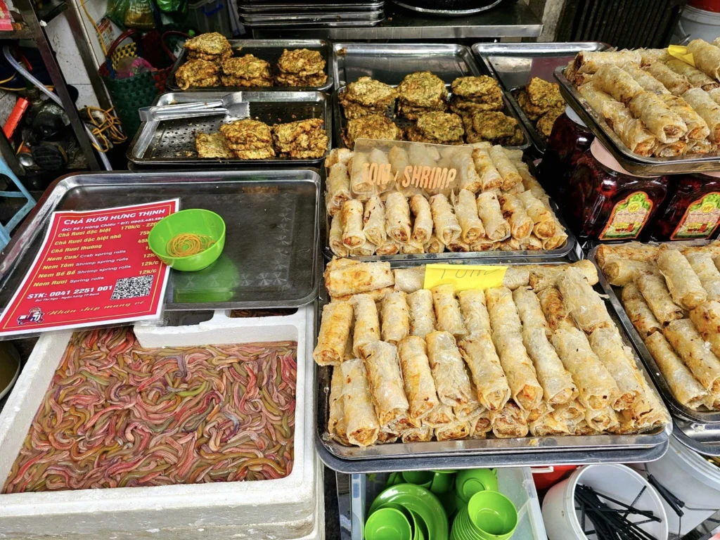 Cruising with Danny and Peter, Holland America Line, Westerdam, Halong Bay, Hanoi, Vietnam, Vietnam Travel Eexperience Hanoi Halong Bay | Kayaking through emerald waters during a Hạ Long Bay Adventure with limestone karsts, a train passing inches from cafés on Hanoi Railway Street showcasing Hanoi Street Life, the granite Ho Chi Minh Mausoleum in Ba Dinh Square honoring the Ho Chi Minh Legacy, the lotus-shaped One Pillar Pagoda in a pond among Hanoi Historical Sites, ancient courtyards of the Temple of Literature from a Vietnam Heritage Journey, vibrant street food stalls in an Old Quarter Food Tour, and creamy egg coffee at Cafe Giảng for an Egg Coffee Experience, all part of an unforgettable Vietnam Travel Experience and Hanoi Cultural Exploration Tour.