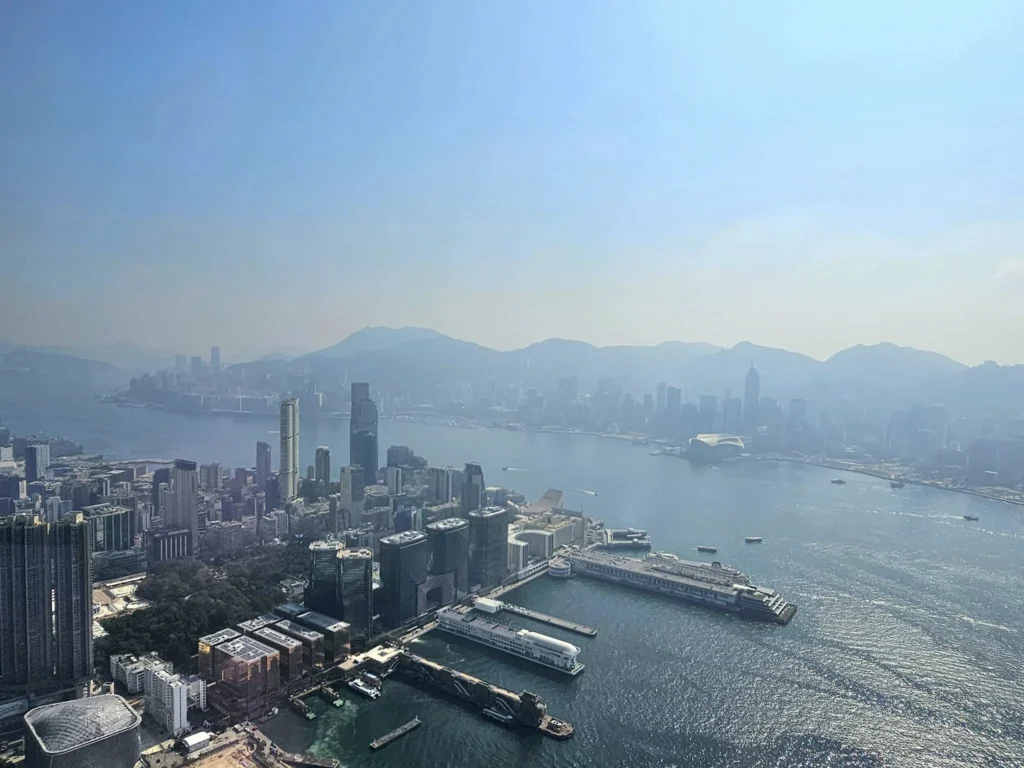 Cruising with Danny and Peter, Holland America Line, Westerdam, Hong Kong, China, Hong Kong Travel Guide: 10 Irresistible Gems | Panoramic Hong Kong Skyline Views from Sky100 Observation Deck showcasing Victoria Harbour and glittering skyscrapers at dusk, paired with a vibrant Temple Street Market scene featuring colorful stalls offering Hong Kong Street Food like dim sum, egg tarts, wonton noodles, and crispy fish balls in a bustling Hong Kong Night Markets atmosphere, alongside a scenic Tsim Sha Tsui Promenade view of Victoria Harbour with illuminated Hong Kong Skyline Views perfect for Hong Kong Tourism evenings, and the Holland America Line’s Westerdam docked in Hong Kong, marking the end of a Cruise Travel Hong Kong journey with Hong Kong Attractions in the background.