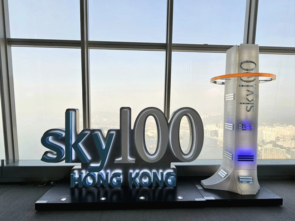 Cruising with Danny and Peter, Holland America Line, Westerdam, Hong Kong, China, Hong Kong Travel Guide: 10 Irresistible Gems | Panoramic Hong Kong Skyline Views from Sky100 Observation Deck showcasing Victoria Harbour and glittering skyscrapers at dusk, paired with a vibrant Temple Street Market scene featuring colorful stalls offering Hong Kong Street Food like dim sum, egg tarts, wonton noodles, and crispy fish balls in a bustling Hong Kong Night Markets atmosphere, alongside a scenic Tsim Sha Tsui Promenade view of Victoria Harbour with illuminated Hong Kong Skyline Views perfect for Hong Kong Tourism evenings, and the Holland America Line’s Westerdam docked in Hong Kong, marking the end of a Cruise Travel Hong Kong journey with Hong Kong Attractions in the background.