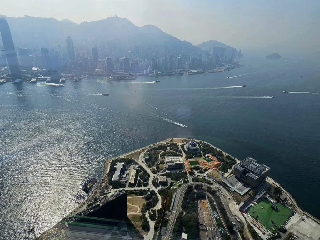 Cruising with Danny and Peter, Holland America Line, Westerdam, Hong Kong, China, Hong Kong Travel Guide: 10 Irresistible Gems | Panoramic Hong Kong Skyline Views from Sky100 Observation Deck showcasing Victoria Harbour and glittering skyscrapers at dusk, paired with a vibrant Temple Street Market scene featuring colorful stalls offering Hong Kong Street Food like dim sum, egg tarts, wonton noodles, and crispy fish balls in a bustling Hong Kong Night Markets atmosphere, alongside a scenic Tsim Sha Tsui Promenade view of Victoria Harbour with illuminated Hong Kong Skyline Views perfect for Hong Kong Tourism evenings, and the Holland America Line’s Westerdam docked in Hong Kong, marking the end of a Cruise Travel Hong Kong journey with Hong Kong Attractions in the background.