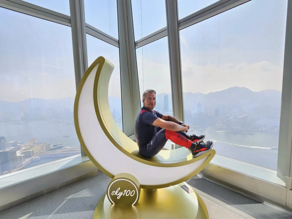 Cruising with Danny and Peter, Holland America Line, Westerdam, Hong Kong, China, Hong Kong Travel Guide: 10 Irresistible Gems | Panoramic Hong Kong Skyline Views from Sky100 Observation Deck showcasing Victoria Harbour and glittering skyscrapers at dusk, paired with a vibrant Temple Street Market scene featuring colorful stalls offering Hong Kong Street Food like dim sum, egg tarts, wonton noodles, and crispy fish balls in a bustling Hong Kong Night Markets atmosphere, alongside a scenic Tsim Sha Tsui Promenade view of Victoria Harbour with illuminated Hong Kong Skyline Views perfect for Hong Kong Tourism evenings, and the Holland America Line’s Westerdam docked in Hong Kong, marking the end of a Cruise Travel Hong Kong journey with Hong Kong Attractions in the background.