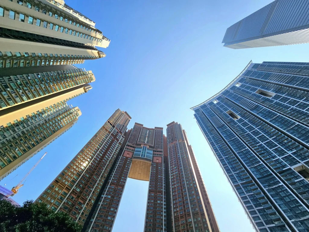 Cruising with Danny and Peter, Holland America Line, Westerdam, Hong Kong, China, Hong Kong Travel Guide: 10 Irresistible Gems | Panoramic Hong Kong Skyline Views from Sky100 Observation Deck showcasing Victoria Harbour and glittering skyscrapers at dusk, paired with a vibrant Temple Street Market scene featuring colorful stalls offering Hong Kong Street Food like dim sum, egg tarts, wonton noodles, and crispy fish balls in a bustling Hong Kong Night Markets atmosphere, alongside a scenic Tsim Sha Tsui Promenade view of Victoria Harbour with illuminated Hong Kong Skyline Views perfect for Hong Kong Tourism evenings, and the Holland America Line’s Westerdam docked in Hong Kong, marking the end of a Cruise Travel Hong Kong journey with Hong Kong Attractions in the background.