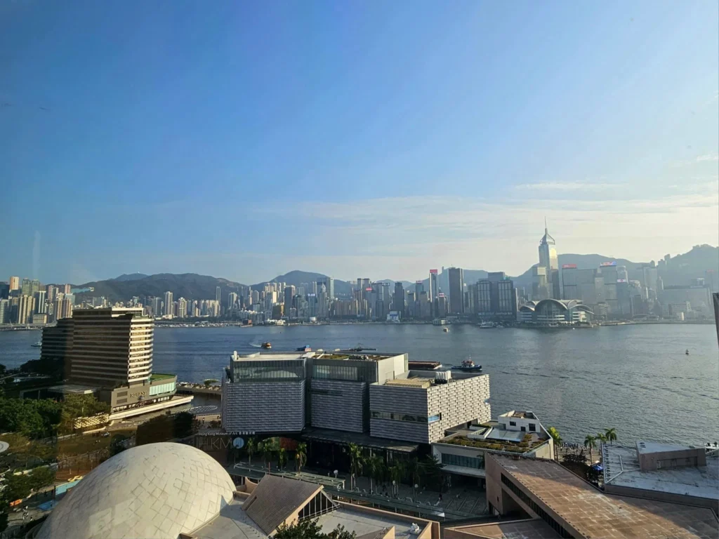 Cruising with Danny and Peter, Holland America Line, Westerdam, Hong Kong, China, Hong Kong Travel Guide: 10 Irresistible Gems | Panoramic Hong Kong Skyline Views from Sky100 Observation Deck showcasing Victoria Harbour and glittering skyscrapers at dusk, paired with a vibrant Temple Street Market scene featuring colorful stalls offering Hong Kong Street Food like dim sum, egg tarts, wonton noodles, and crispy fish balls in a bustling Hong Kong Night Markets atmosphere, alongside a scenic Tsim Sha Tsui Promenade view of Victoria Harbour with illuminated Hong Kong Skyline Views perfect for Hong Kong Tourism evenings, and the Holland America Line’s Westerdam docked in Hong Kong, marking the end of a Cruise Travel Hong Kong journey with Hong Kong Attractions in the background.