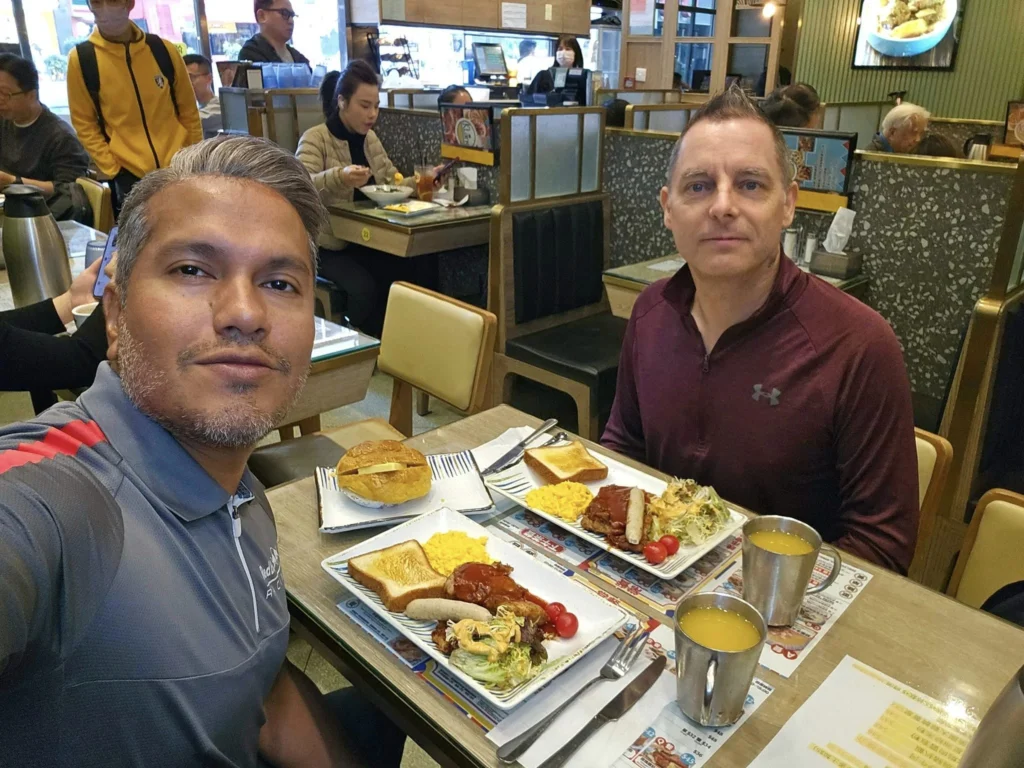 A Journey to Remember: Our Tsim Sha Tsui Travel Experience Aboard the Westerdam and Beyond 2 Cruising with Danny and Peter, Holland America Line, Westerdam, Hong Kong, China, Tsim Sha Tsui Travel Experience | Reliving our Tsim Sha Tsui Travel Experience: savoring Local Hong Kong Food like creamy eggs and sweet bacon, admiring the Hong Kong Skyline from Tsim Sha Tsui Promenade, bidding farewell to the Westerdam Cruise on a Harbor Tour Hong Kong across Victoria Harbour, exploring Hong Kong Shopping in vibrant markets and boutiques, and marveling at Hong Kong Night Lights illuminating the skyline from our hotel in Tsim Sha Tsui.