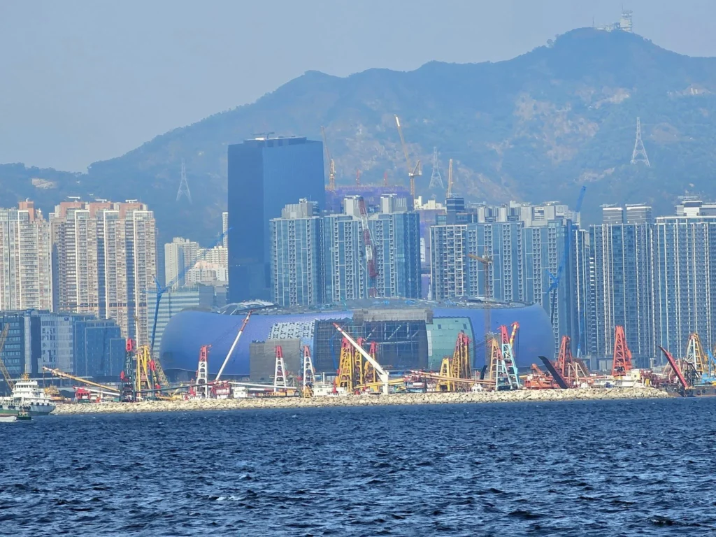 A Journey to Remember: Our Tsim Sha Tsui Travel Experience Aboard the Westerdam and Beyond 52 Cruising with Danny and Peter, Holland America Line, Westerdam, Hong Kong, China, Tsim Sha Tsui Travel Experience | Reliving our Tsim Sha Tsui Travel Experience: savoring Local Hong Kong Food like creamy eggs and sweet bacon, admiring the Hong Kong Skyline from Tsim Sha Tsui Promenade, bidding farewell to the Westerdam Cruise on a Harbor Tour Hong Kong across Victoria Harbour, exploring Hong Kong Shopping in vibrant markets and boutiques, and marveling at Hong Kong Night Lights illuminating the skyline from our hotel in Tsim Sha Tsui.