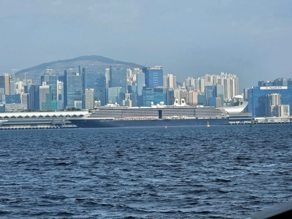 A Journey to Remember: Our Tsim Sha Tsui Travel Experience Aboard the Westerdam and Beyond 53 Cruising with Danny and Peter, Holland America Line, Westerdam, Hong Kong, China, Tsim Sha Tsui Travel Experience | Reliving our Tsim Sha Tsui Travel Experience: savoring Local Hong Kong Food like creamy eggs and sweet bacon, admiring the Hong Kong Skyline from Tsim Sha Tsui Promenade, bidding farewell to the Westerdam Cruise on a Harbor Tour Hong Kong across Victoria Harbour, exploring Hong Kong Shopping in vibrant markets and boutiques, and marveling at Hong Kong Night Lights illuminating the skyline from our hotel in Tsim Sha Tsui.