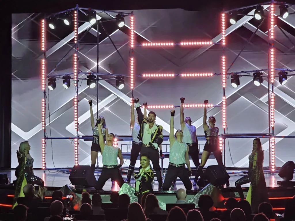 Cruising with Danny and Peter, MSC Cruises, MSC Preziosa, Rotterdam, The Netherlands, MSC Preziosa Cruise departing from Rotterdam Cruise Port, showcasing the luxurious MSC Cruises experience on the Northern Europe Cruise. Passengers enjoying a seamless embarkation process, followed by elegant dining at Il Cappuccino, indulging in world-class cruise dining & shows. Exciting onboard entertainment, including a thrilling 4D cinema experience at XD Studio and the electrifying Rock Nation performance at the Platinum Theatre. Guests dancing at the vibrant MSC White Party in the Safari Lounge, highlighting the unforgettable European cruise experience. Stunning ocean views and luxury cruise vacation moments captured along the MSC Preziosa Itinerary through breathtaking North Sea Travel.