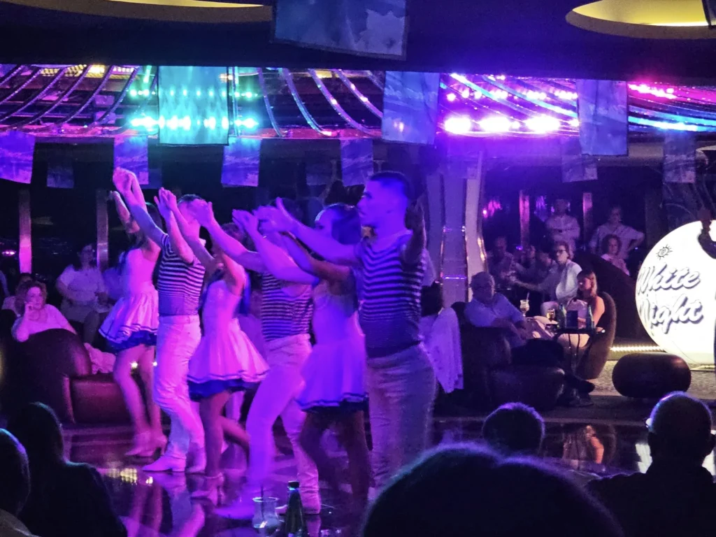 Cruising with Danny and Peter, MSC Cruises, MSC Preziosa, Rotterdam, The Netherlands, MSC Preziosa Cruise departing from Rotterdam Cruise Port, showcasing the luxurious MSC Cruises experience on the Northern Europe Cruise. Passengers enjoying a seamless embarkation process, followed by elegant dining at Il Cappuccino, indulging in world-class cruise dining & shows. Exciting onboard entertainment, including a thrilling 4D cinema experience at XD Studio and the electrifying Rock Nation performance at the Platinum Theatre. Guests dancing at the vibrant MSC White Party in the Safari Lounge, highlighting the unforgettable European cruise experience. Stunning ocean views and luxury cruise vacation moments captured along the MSC Preziosa Itinerary through breathtaking North Sea Travel.