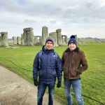 Cruising with Danny and Peter, MSC Cruises, MSC Preziosa, Southamton, London, England, United Kingdom, Stonehenge & Salisbury Tour, A breathtaking view of the Ancient Stone Circle at Stonehenge, showcasing its massive standing stones against the backdrop of the Wiltshire Countryside Trip. Visitors exploring this iconic Neolithic Monument Visit, a renowned UNESCO Heritage Site, as part of the MSC Preziosa Stonehenge and Salisbury Excursion. The towering spire of Salisbury Cathedral, the highlight of the Salisbury Cathedral Tour, stands majestically, housing the historic Magna Carta Exhibit. A scenic drive through the charming English villages on the English Countryside Tour, leading to a fascinating Medieval Town Exploration in Salisbury. This Southampton Shore Excursion offers an unforgettable journey through Historic England Landmarks, blending ancient wonders with medieval splendor.