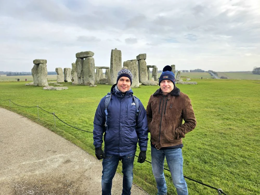 Cruising with Danny and Peter, MSC Cruises, MSC Preziosa, Southamton, London, England, United Kingdom, Stonehenge & Salisbury Tour, A breathtaking view of the Ancient Stone Circle at Stonehenge, showcasing its massive standing stones against the backdrop of the Wiltshire Countryside Trip. Visitors exploring this iconic Neolithic Monument Visit, a renowned UNESCO Heritage Site, as part of the MSC Preziosa Stonehenge and Salisbury Excursion. The towering spire of Salisbury Cathedral, the highlight of the Salisbury Cathedral Tour, stands majestically, housing the historic Magna Carta Exhibit. A scenic drive through the charming English villages on the English Countryside Tour, leading to a fascinating Medieval Town Exploration in Salisbury. This Southampton Shore Excursion offers an unforgettable journey through Historic England Landmarks, blending ancient wonders with medieval splendor.