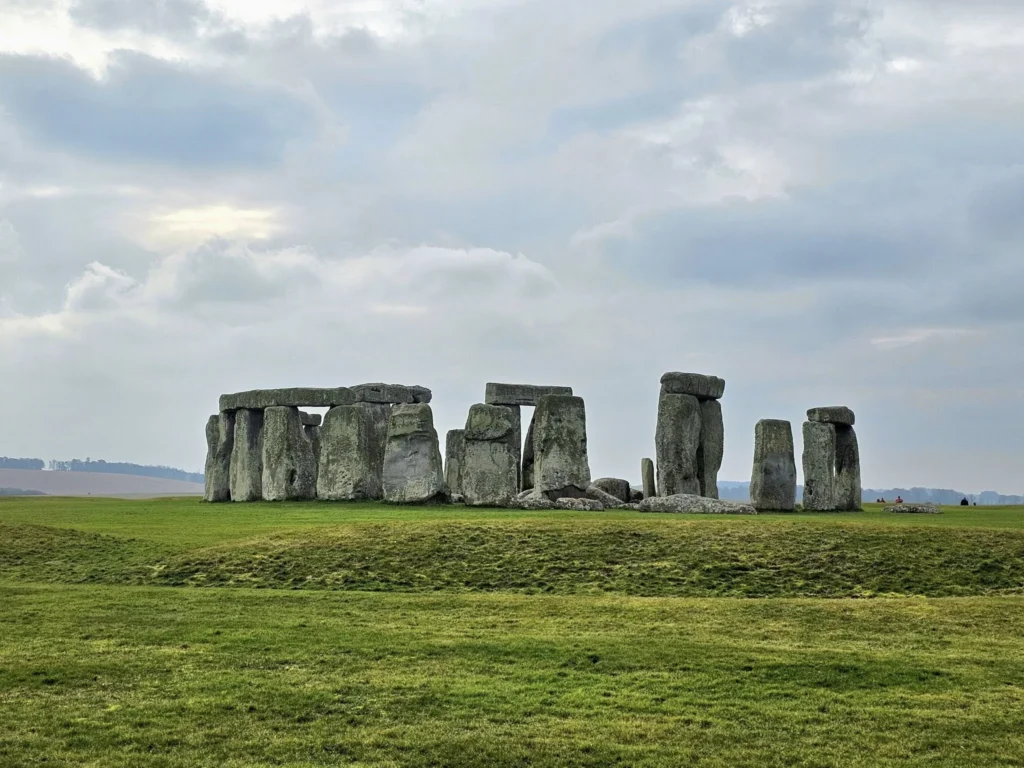 Cruising with Danny and Peter, MSC Cruises, MSC Preziosa, Southamton, London, England, United Kingdom, Stonehenge & Salisbury Tour, A breathtaking view of the Ancient Stone Circle at Stonehenge, showcasing its massive standing stones against the backdrop of the Wiltshire Countryside Trip. Visitors exploring this iconic Neolithic Monument Visit, a renowned UNESCO Heritage Site, as part of the MSC Preziosa Stonehenge and Salisbury Excursion. The towering spire of Salisbury Cathedral, the highlight of the Salisbury Cathedral Tour, stands majestically, housing the historic Magna Carta Exhibit. A scenic drive through the charming English villages on the English Countryside Tour, leading to a fascinating Medieval Town Exploration in Salisbury. This Southampton Shore Excursion offers an unforgettable journey through Historic England Landmarks, blending ancient wonders with medieval splendor.
