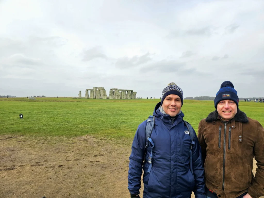 Cruising with Danny and Peter, MSC Cruises, MSC Preziosa, Southamton, London, England, United Kingdom, Stonehenge & Salisbury Tour, A breathtaking view of the Ancient Stone Circle at Stonehenge, showcasing its massive standing stones against the backdrop of the Wiltshire Countryside Trip. Visitors exploring this iconic Neolithic Monument Visit, a renowned UNESCO Heritage Site, as part of the MSC Preziosa Stonehenge and Salisbury Excursion. The towering spire of Salisbury Cathedral, the highlight of the Salisbury Cathedral Tour, stands majestically, housing the historic Magna Carta Exhibit. A scenic drive through the charming English villages on the English Countryside Tour, leading to a fascinating Medieval Town Exploration in Salisbury. This Southampton Shore Excursion offers an unforgettable journey through Historic England Landmarks, blending ancient wonders with medieval splendor.