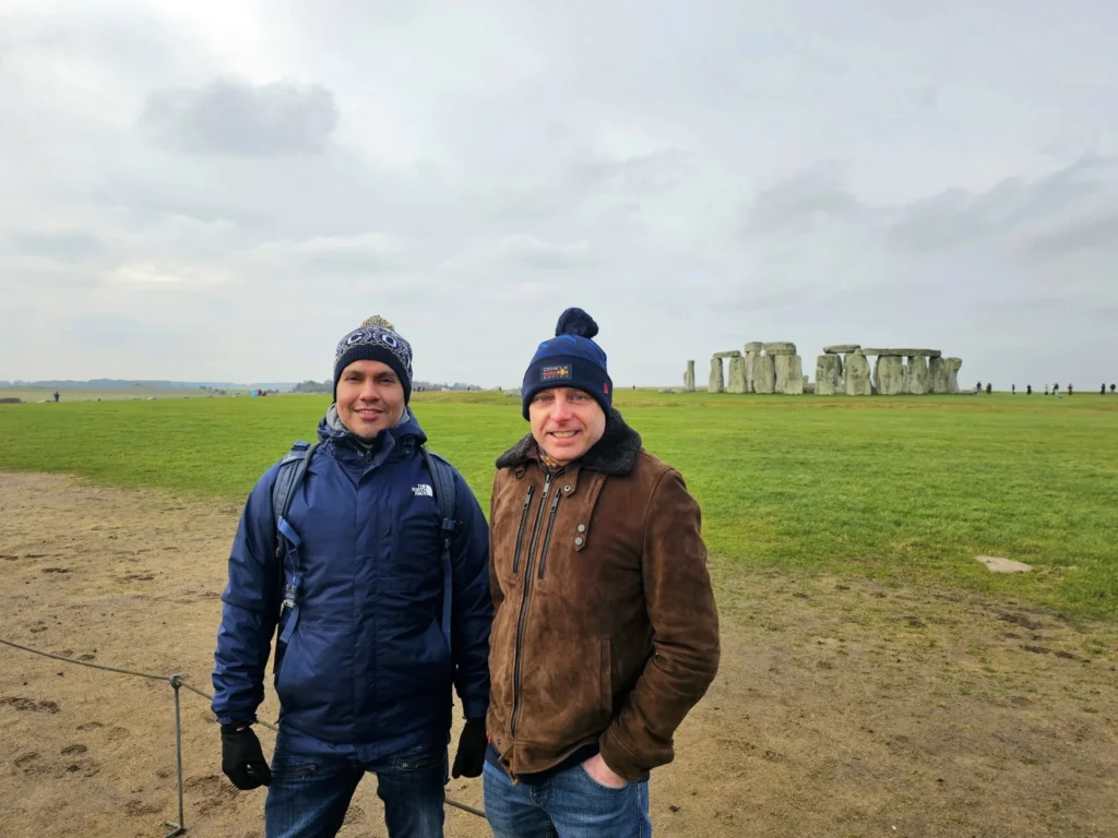 Cruising with Danny and Peter, MSC Cruises, MSC Preziosa, Southamton, London, England, United Kingdom, Stonehenge & Salisbury Tour, A breathtaking view of the Ancient Stone Circle at Stonehenge, showcasing its massive standing stones against the backdrop of the Wiltshire Countryside Trip. Visitors exploring this iconic Neolithic Monument Visit, a renowned UNESCO Heritage Site, as part of the MSC Preziosa Stonehenge and Salisbury Excursion. The towering spire of Salisbury Cathedral, the highlight of the Salisbury Cathedral Tour, stands majestically, housing the historic Magna Carta Exhibit. A scenic drive through the charming English villages on the English Countryside Tour, leading to a fascinating Medieval Town Exploration in Salisbury. This Southampton Shore Excursion offers an unforgettable journey through Historic England Landmarks, blending ancient wonders with medieval splendor.