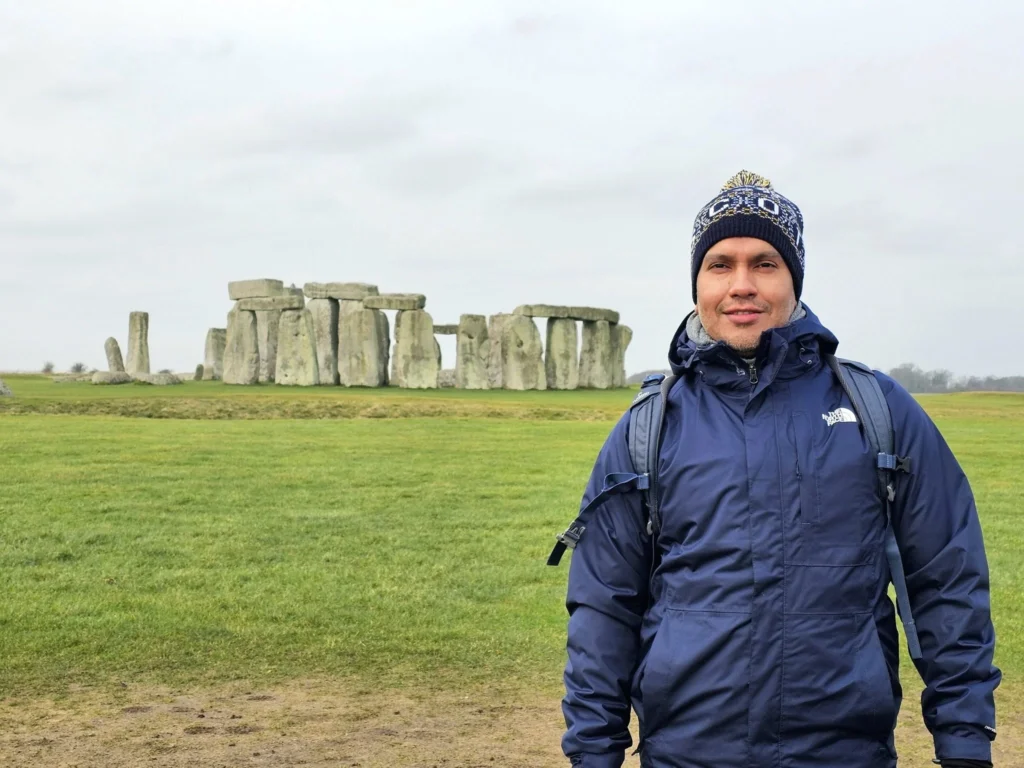 Cruising with Danny and Peter, MSC Cruises, MSC Preziosa, Southamton, London, England, United Kingdom, Stonehenge & Salisbury Tour, A breathtaking view of the Ancient Stone Circle at Stonehenge, showcasing its massive standing stones against the backdrop of the Wiltshire Countryside Trip. Visitors exploring this iconic Neolithic Monument Visit, a renowned UNESCO Heritage Site, as part of the MSC Preziosa Stonehenge and Salisbury Excursion. The towering spire of Salisbury Cathedral, the highlight of the Salisbury Cathedral Tour, stands majestically, housing the historic Magna Carta Exhibit. A scenic drive through the charming English villages on the English Countryside Tour, leading to a fascinating Medieval Town Exploration in Salisbury. This Southampton Shore Excursion offers an unforgettable journey through Historic England Landmarks, blending ancient wonders with medieval splendor.