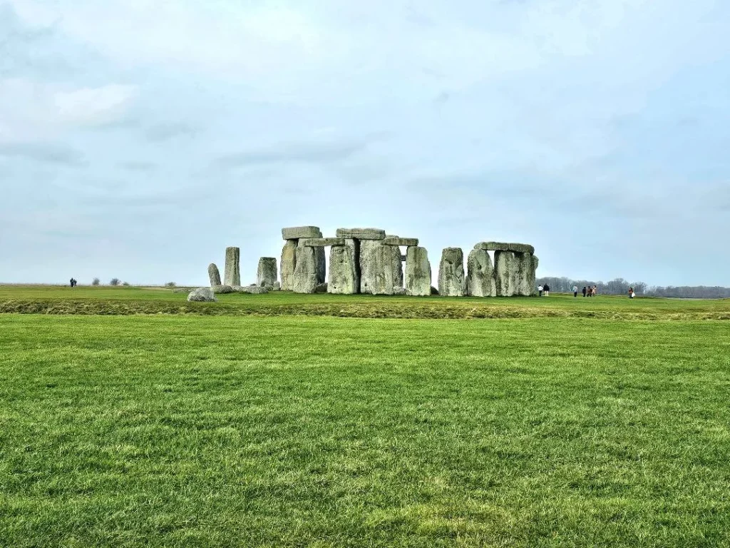 Cruising with Danny and Peter, MSC Cruises, MSC Preziosa, Southamton, London, England, United Kingdom, Stonehenge & Salisbury Tour, A breathtaking view of the Ancient Stone Circle at Stonehenge, showcasing its massive standing stones against the backdrop of the Wiltshire Countryside Trip. Visitors exploring this iconic Neolithic Monument Visit, a renowned UNESCO Heritage Site, as part of the MSC Preziosa Stonehenge and Salisbury Excursion. The towering spire of Salisbury Cathedral, the highlight of the Salisbury Cathedral Tour, stands majestically, housing the historic Magna Carta Exhibit. A scenic drive through the charming English villages on the English Countryside Tour, leading to a fascinating Medieval Town Exploration in Salisbury. This Southampton Shore Excursion offers an unforgettable journey through Historic England Landmarks, blending ancient wonders with medieval splendor.