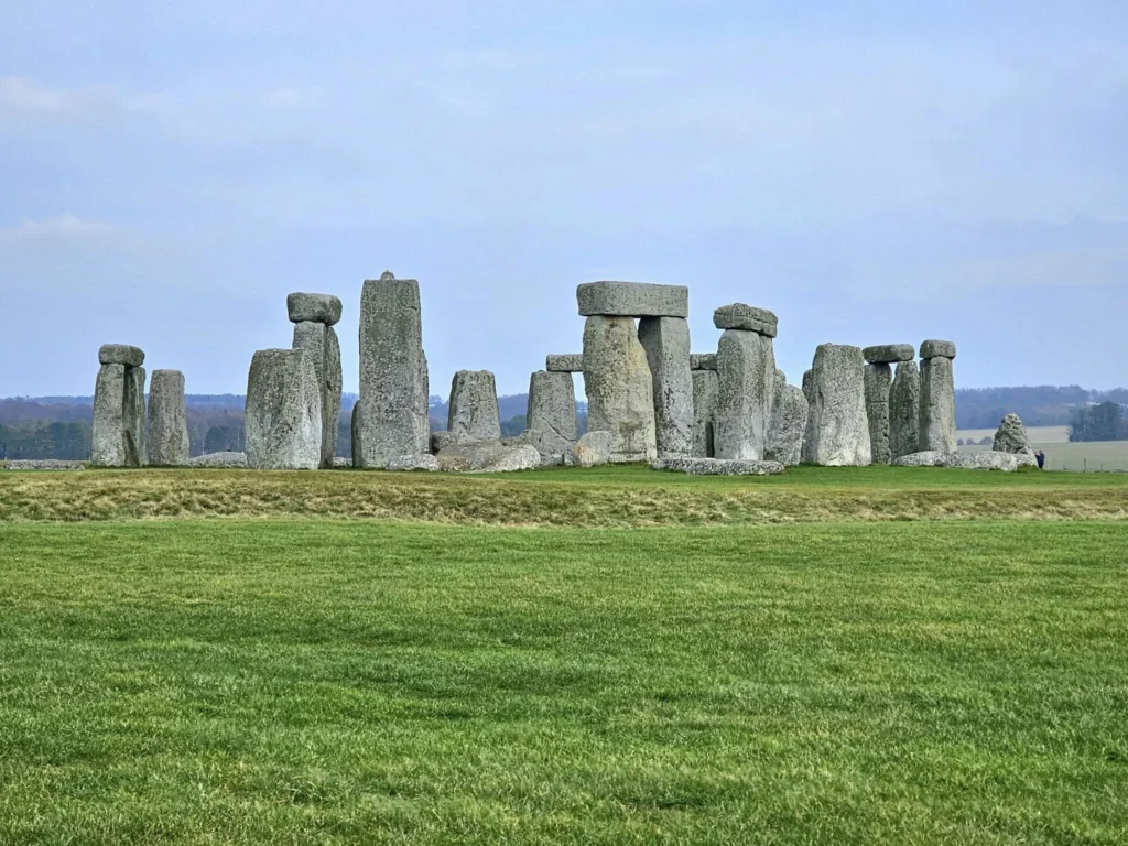 Cruising with Danny and Peter, MSC Cruises, MSC Preziosa, Southamton, London, England, United Kingdom, Stonehenge & Salisbury Tour, A breathtaking view of the Ancient Stone Circle at Stonehenge, showcasing its massive standing stones against the backdrop of the Wiltshire Countryside Trip. Visitors exploring this iconic Neolithic Monument Visit, a renowned UNESCO Heritage Site, as part of the MSC Preziosa Stonehenge and Salisbury Excursion. The towering spire of Salisbury Cathedral, the highlight of the Salisbury Cathedral Tour, stands majestically, housing the historic Magna Carta Exhibit. A scenic drive through the charming English villages on the English Countryside Tour, leading to a fascinating Medieval Town Exploration in Salisbury. This Southampton Shore Excursion offers an unforgettable journey through Historic England Landmarks, blending ancient wonders with medieval splendor.