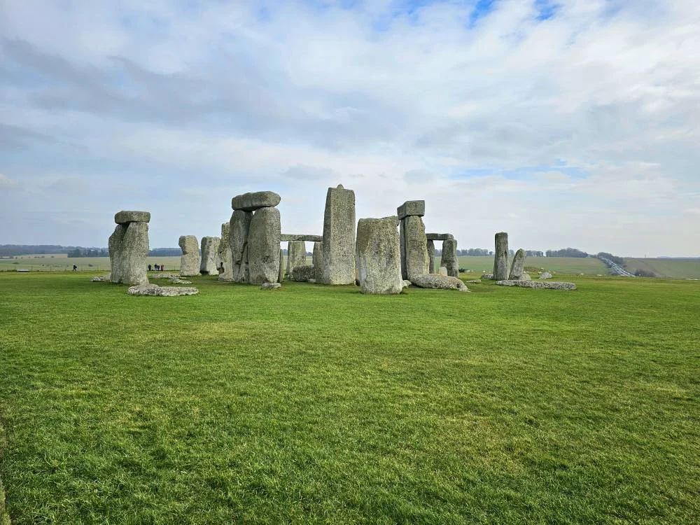 Cruising with Danny and Peter, MSC Cruises, MSC Preziosa, Southamton, London, England, United Kingdom, Stonehenge & Salisbury Tour, A breathtaking view of the Ancient Stone Circle at Stonehenge, showcasing its massive standing stones against the backdrop of the Wiltshire Countryside Trip. Visitors exploring this iconic Neolithic Monument Visit, a renowned UNESCO Heritage Site, as part of the MSC Preziosa Stonehenge and Salisbury Excursion. The towering spire of Salisbury Cathedral, the highlight of the Salisbury Cathedral Tour, stands majestically, housing the historic Magna Carta Exhibit. A scenic drive through the charming English villages on the English Countryside Tour, leading to a fascinating Medieval Town Exploration in Salisbury. This Southampton Shore Excursion offers an unforgettable journey through Historic England Landmarks, blending ancient wonders with medieval splendor.