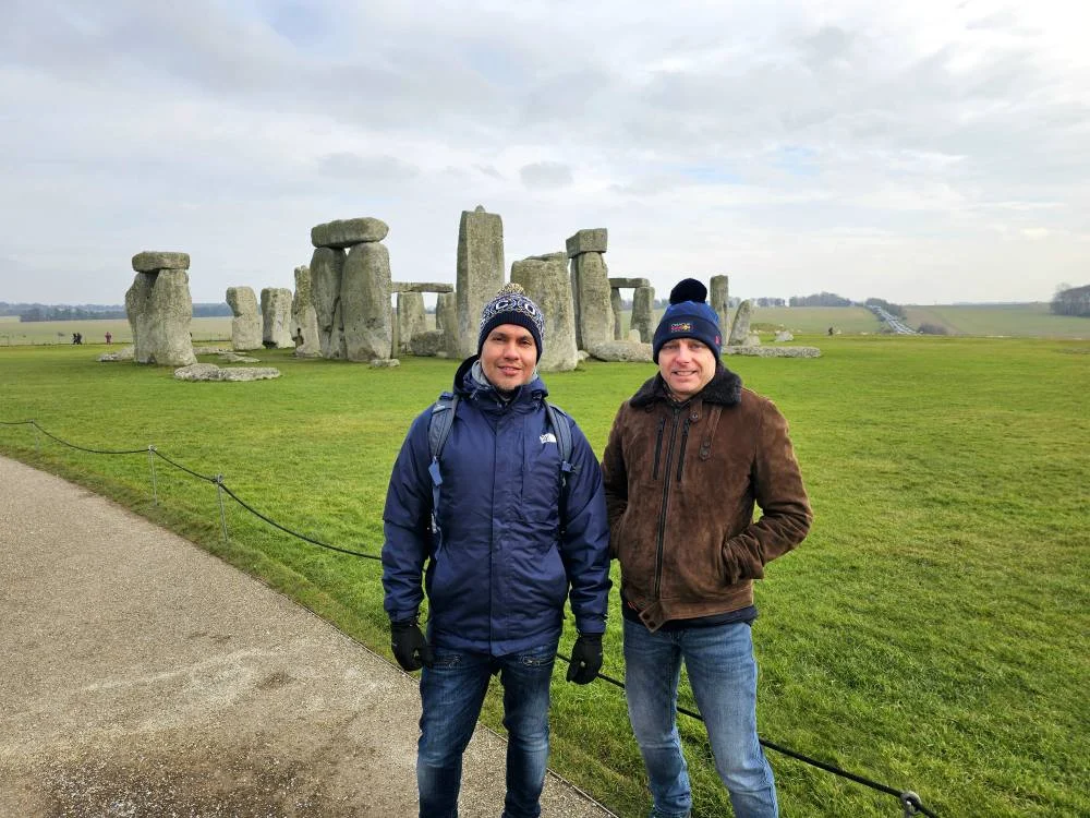 Cruising with Danny and Peter, MSC Cruises, MSC Preziosa, Southamton, London, England, United Kingdom, Stonehenge & Salisbury Tour, A breathtaking view of the Ancient Stone Circle at Stonehenge, showcasing its massive standing stones against the backdrop of the Wiltshire Countryside Trip. Visitors exploring this iconic Neolithic Monument Visit, a renowned UNESCO Heritage Site, as part of the MSC Preziosa Stonehenge and Salisbury Excursion. The towering spire of Salisbury Cathedral, the highlight of the Salisbury Cathedral Tour, stands majestically, housing the historic Magna Carta Exhibit. A scenic drive through the charming English villages on the English Countryside Tour, leading to a fascinating Medieval Town Exploration in Salisbury. This Southampton Shore Excursion offers an unforgettable journey through Historic England Landmarks, blending ancient wonders with medieval splendor.