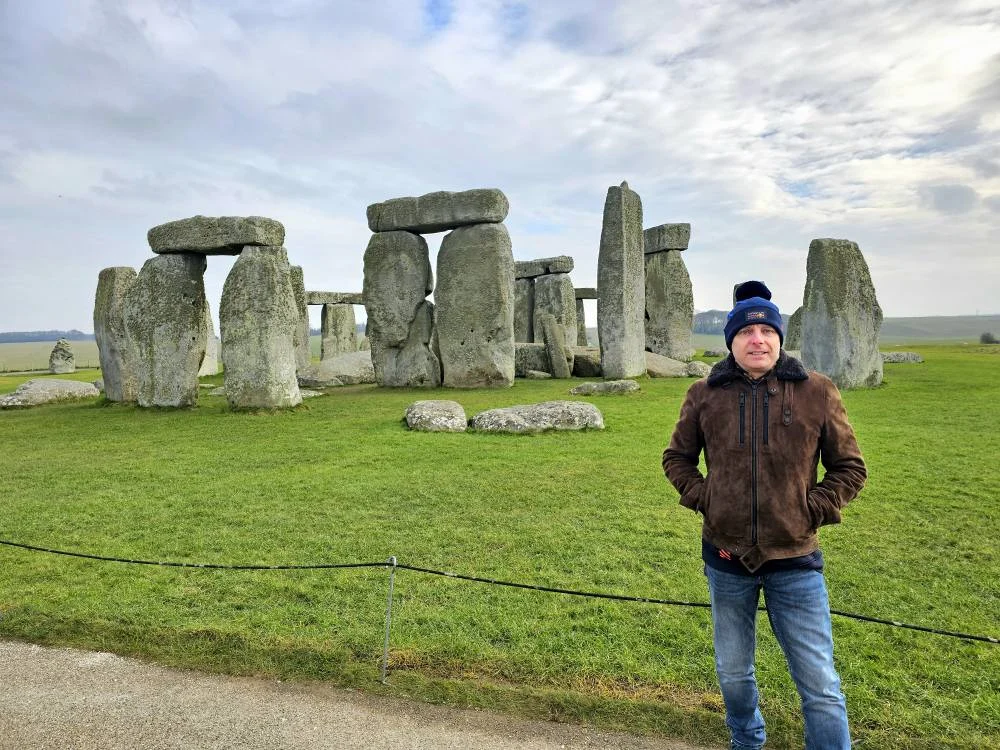 Cruising with Danny and Peter, MSC Cruises, MSC Preziosa, Southamton, London, England, United Kingdom, Stonehenge & Salisbury Tour, A breathtaking view of the Ancient Stone Circle at Stonehenge, showcasing its massive standing stones against the backdrop of the Wiltshire Countryside Trip. Visitors exploring this iconic Neolithic Monument Visit, a renowned UNESCO Heritage Site, as part of the MSC Preziosa Stonehenge and Salisbury Excursion. The towering spire of Salisbury Cathedral, the highlight of the Salisbury Cathedral Tour, stands majestically, housing the historic Magna Carta Exhibit. A scenic drive through the charming English villages on the English Countryside Tour, leading to a fascinating Medieval Town Exploration in Salisbury. This Southampton Shore Excursion offers an unforgettable journey through Historic England Landmarks, blending ancient wonders with medieval splendor.