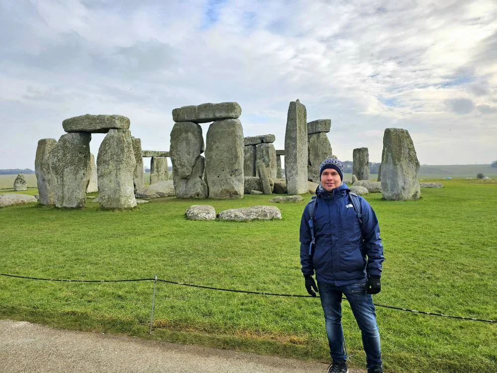 Cruising with Danny and Peter, MSC Cruises, MSC Preziosa, Southamton, London, England, United Kingdom, Stonehenge & Salisbury Tour, A breathtaking view of the Ancient Stone Circle at Stonehenge, showcasing its massive standing stones against the backdrop of the Wiltshire Countryside Trip. Visitors exploring this iconic Neolithic Monument Visit, a renowned UNESCO Heritage Site, as part of the MSC Preziosa Stonehenge and Salisbury Excursion. The towering spire of Salisbury Cathedral, the highlight of the Salisbury Cathedral Tour, stands majestically, housing the historic Magna Carta Exhibit. A scenic drive through the charming English villages on the English Countryside Tour, leading to a fascinating Medieval Town Exploration in Salisbury. This Southampton Shore Excursion offers an unforgettable journey through Historic England Landmarks, blending ancient wonders with medieval splendor.