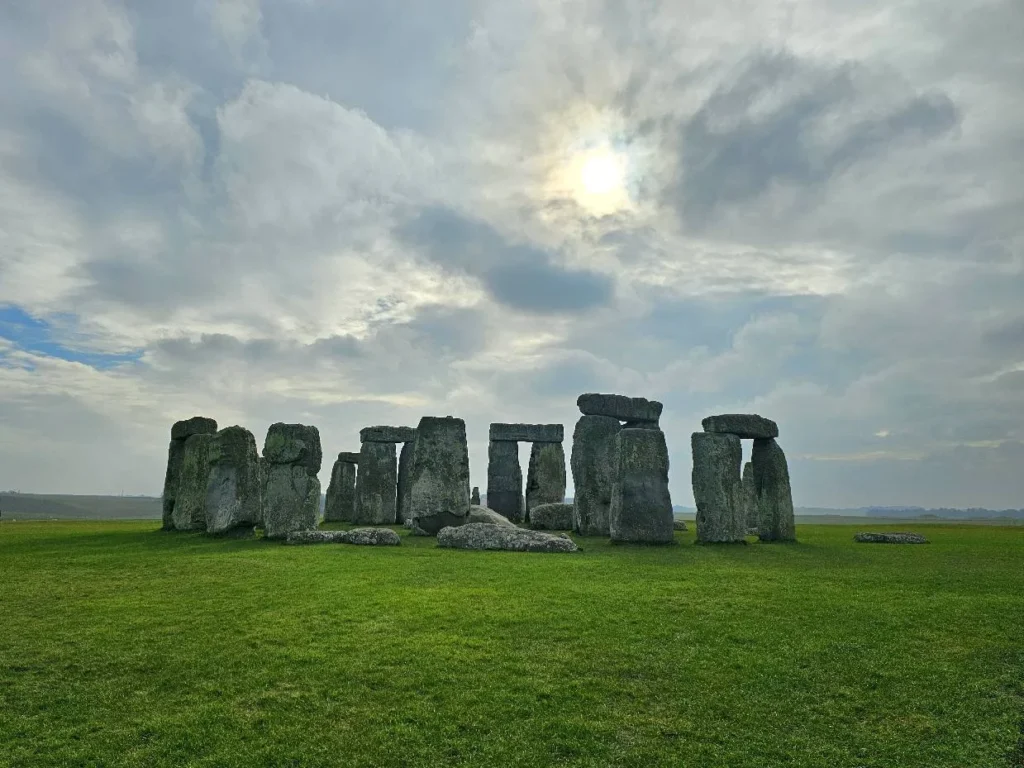 Cruising with Danny and Peter, MSC Cruises, MSC Preziosa, Southamton, London, England, United Kingdom, Stonehenge & Salisbury Tour, A breathtaking view of the Ancient Stone Circle at Stonehenge, showcasing its massive standing stones against the backdrop of the Wiltshire Countryside Trip. Visitors exploring this iconic Neolithic Monument Visit, a renowned UNESCO Heritage Site, as part of the MSC Preziosa Stonehenge and Salisbury Excursion. The towering spire of Salisbury Cathedral, the highlight of the Salisbury Cathedral Tour, stands majestically, housing the historic Magna Carta Exhibit. A scenic drive through the charming English villages on the English Countryside Tour, leading to a fascinating Medieval Town Exploration in Salisbury. This Southampton Shore Excursion offers an unforgettable journey through Historic England Landmarks, blending ancient wonders with medieval splendor.