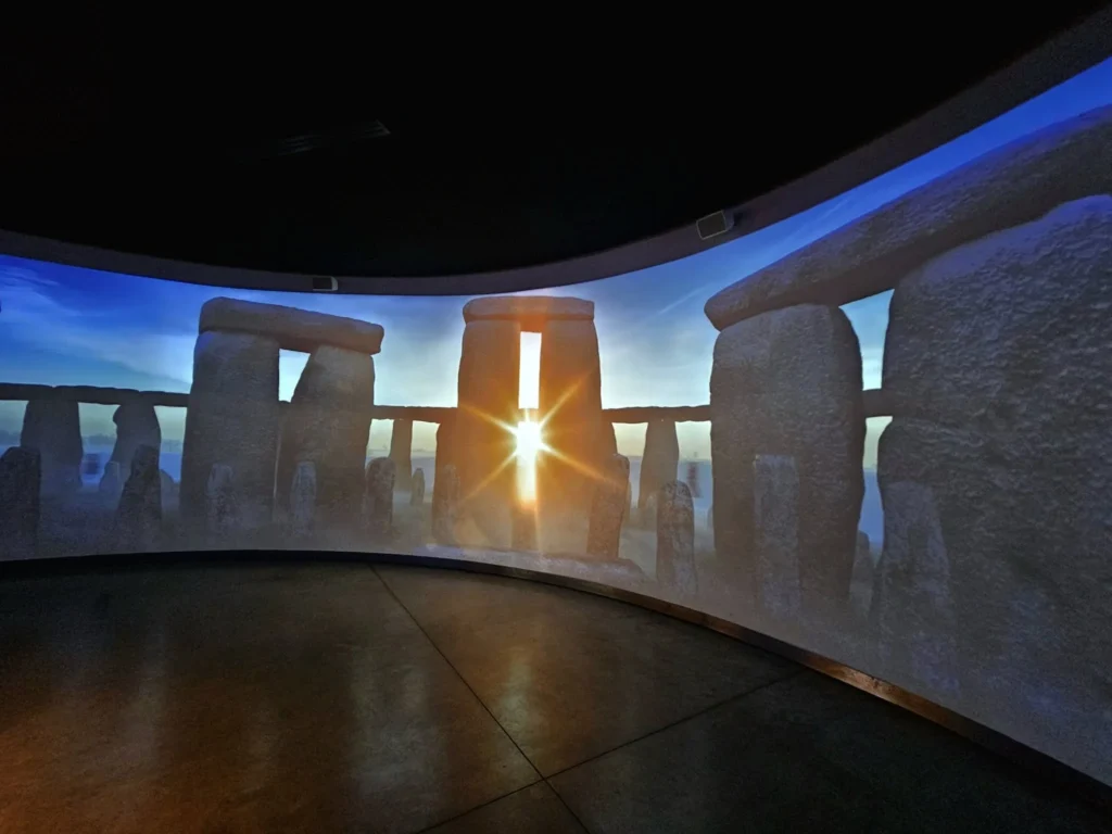 Cruising with Danny and Peter, MSC Cruises, MSC Preziosa, Southamton, London, England, United Kingdom, Stonehenge & Salisbury Tour, A breathtaking view of the Ancient Stone Circle at Stonehenge, showcasing its massive standing stones against the backdrop of the Wiltshire Countryside Trip. Visitors exploring this iconic Neolithic Monument Visit, a renowned UNESCO Heritage Site, as part of the MSC Preziosa Stonehenge and Salisbury Excursion. The towering spire of Salisbury Cathedral, the highlight of the Salisbury Cathedral Tour, stands majestically, housing the historic Magna Carta Exhibit. A scenic drive through the charming English villages on the English Countryside Tour, leading to a fascinating Medieval Town Exploration in Salisbury. This Southampton Shore Excursion offers an unforgettable journey through Historic England Landmarks, blending ancient wonders with medieval splendor.