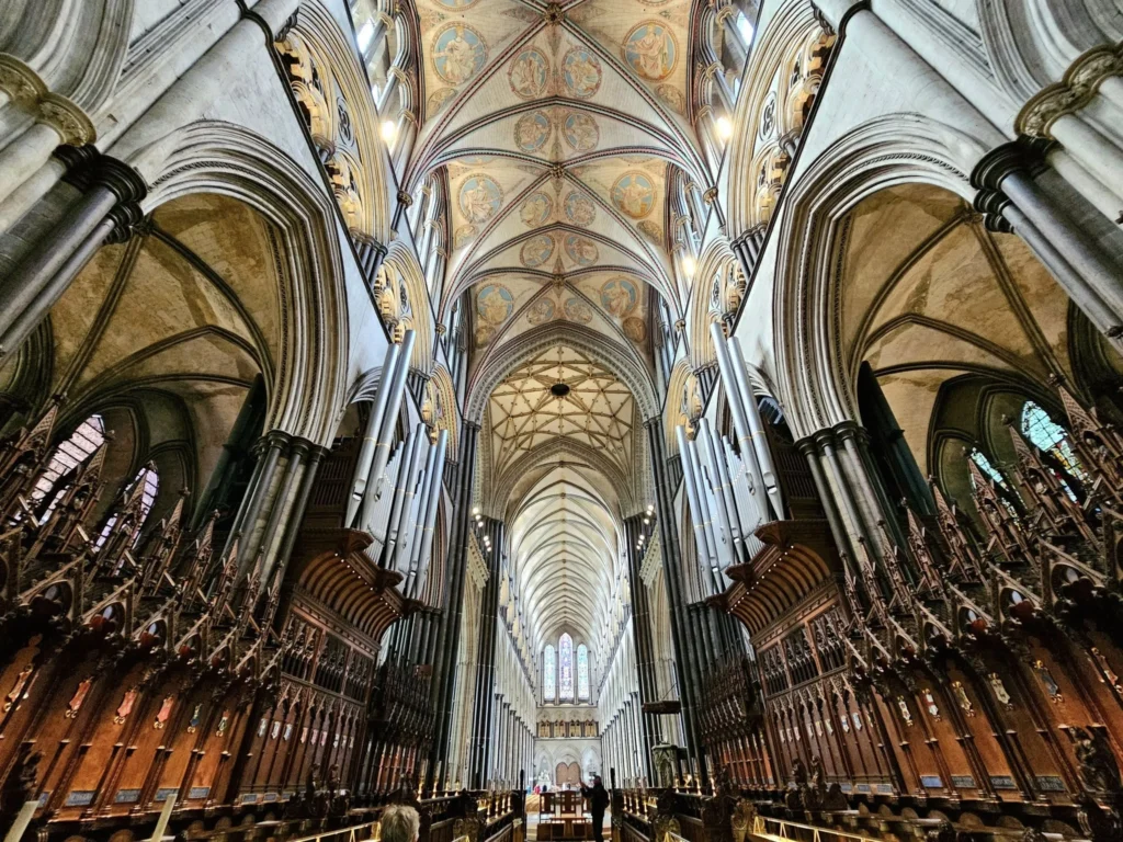 Cruising with Danny and Peter, MSC Cruises, MSC Preziosa, Southamton, London, England, United Kingdom, Stonehenge & Salisbury Tour, A breathtaking view of the Ancient Stone Circle at Stonehenge, showcasing its massive standing stones against the backdrop of the Wiltshire Countryside Trip. Visitors exploring this iconic Neolithic Monument Visit, a renowned UNESCO Heritage Site, as part of the MSC Preziosa Stonehenge and Salisbury Excursion. The towering spire of Salisbury Cathedral, the highlight of the Salisbury Cathedral Tour, stands majestically, housing the historic Magna Carta Exhibit. A scenic drive through the charming English villages on the English Countryside Tour, leading to a fascinating Medieval Town Exploration in Salisbury. This Southampton Shore Excursion offers an unforgettable journey through Historic England Landmarks, blending ancient wonders with medieval splendor.